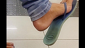 Amateur flip-flop dangling on bank