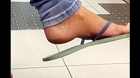 Amateur flip-flop dangling on bank