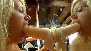 Amazing babes gagging on big dildo