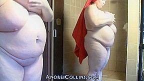 Anorei is a fat woman with gigantic tits, who likes to do posing in the shower
