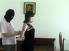 Asian Girl Tied In Black Dress