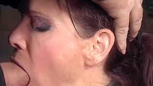 BDSM milf drooling while being throated
