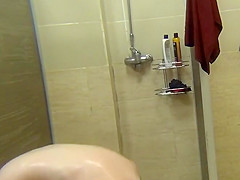 Baby with a smooth body taking a shower after a workout 
