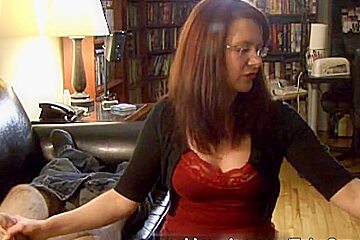 Brunette babe giving handjob while smoking
