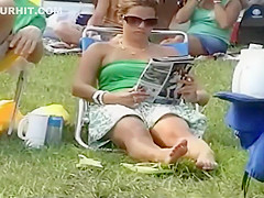 Bulging pink panties spied while she sits