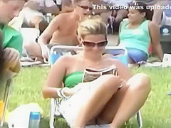Bulging pink panties spied while she sits