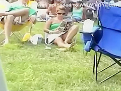Bulging pink panties spied while she sits