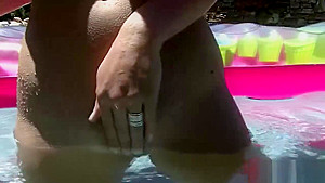 Busty babe with clean shaved pussy on the pool