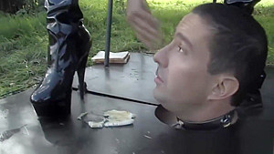 Busty bdsm femdoms sub eats food of her boots
