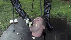 Busty bdsm femdoms sub eats food of her boots