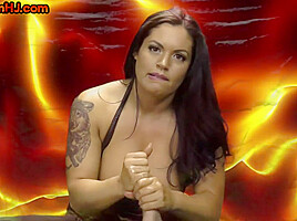 Busty inked femdom giving mean handjobs