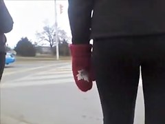 Candid street booty wrapped into tight pants on a cool day