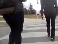 Candid street booty wrapped into tight pants on a cool day