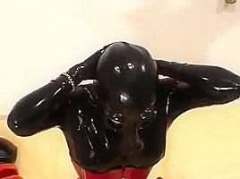 Catsuit Fetish girl in latex corset
