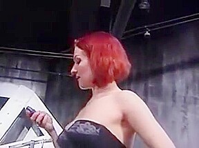 Curvy redhead shackled by lingere dominatrix