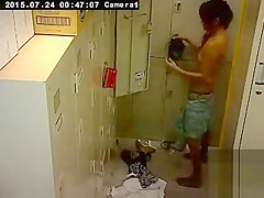 Cute Asian girl changes in the locker room