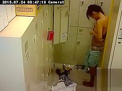 Cute Asian girl changes in the locker room