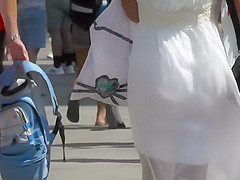 Cute girl in a white summer dress