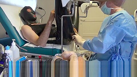 Doctor Fists and Sounds Latex Slave with Gloves in Gyno Chair