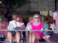 German ladies at the bar show their shaved cunts