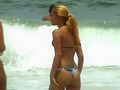 Girl adjust her bathing suit - GNDBeachVideos
