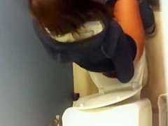 Girl spied over the toilet wall peeing