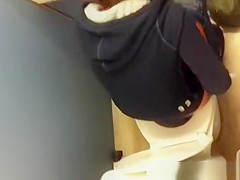 Girl spied over the toilet wall peeing