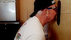 Gloryhole mature DILF blowing and tugging black cock