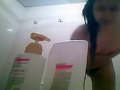 Hairy bush and small tits woman showering