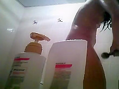 Hairy bush and small tits woman showering