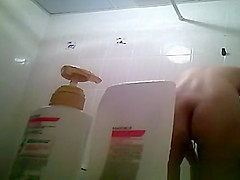 Hairy bush and small tits woman showering