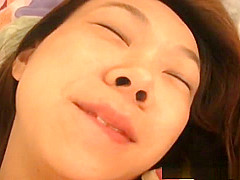 Horny Asian babe masturbates on bed