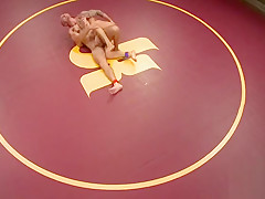 Inked wrestler pins down his muscly opponent
