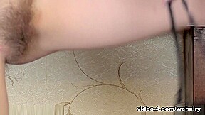 Isabel Stern masturbates by her brown couch