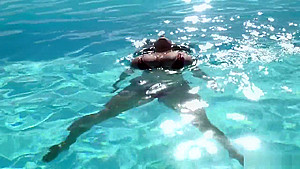 Issy aka Dominican Poison playing in the pool
