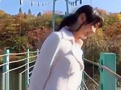 Japanese beauty gives blowjob outdoor
