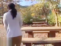 Japanese beauty gives blowjob outdoor