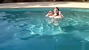 Lexxi Luxe swims half nude in a pool 