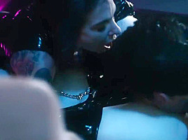 Man with tattoo on the body have arranged for the girls in latex group   