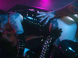 Man with tattoo on the body have arranged for the girls in latex group   