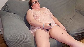 Mummy Playing With Toy On The Couch