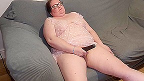 Mummy Playing With Toy On The Couch