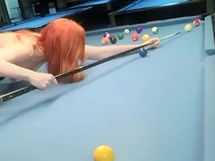 Naked babes play a game of competitive pool