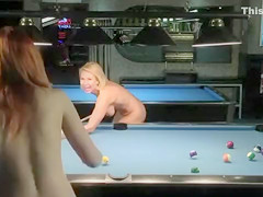 Naked babes play a game of competitive pool