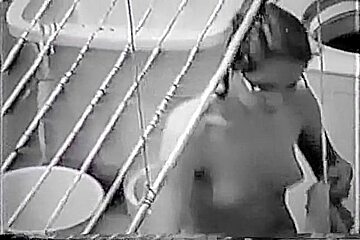 Nude Latin chick spied doing her laundry thru the window