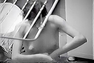 Nude Latin chick spied doing her laundry thru the window