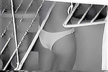 Nude Latin chick spied doing her laundry thru the window