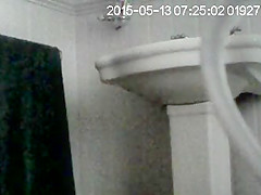 Partner on in bathroom getting undressed to wash
