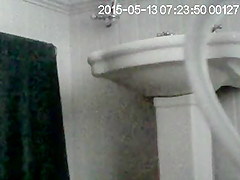 Partner on in bathroom getting undressed to wash