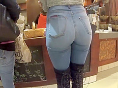 Perfect girl in tight jeans and high boots